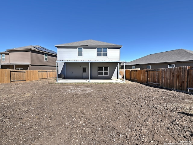 rear view of property featuring a patio