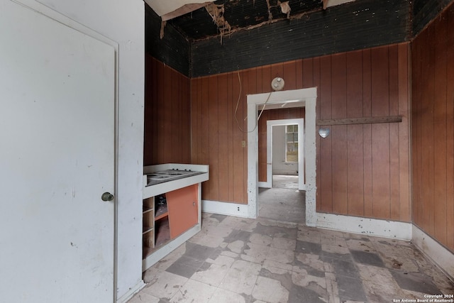 interior space featuring wooden walls