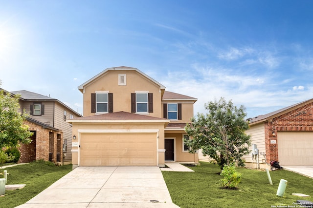 front facade with a front lawn and a garage