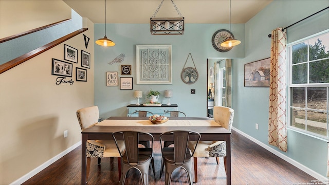 dining space with dark hardwood / wood-style floors