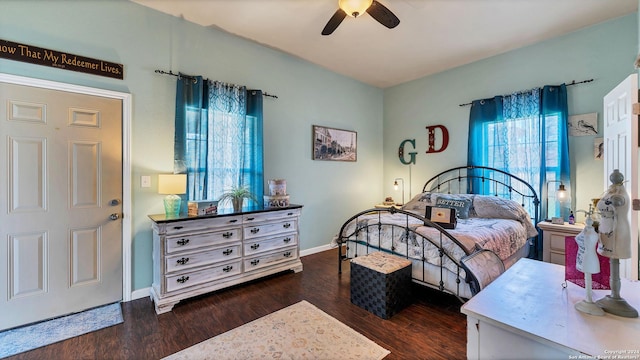 bedroom featuring ceiling fan and dark hardwood / wood-style floors