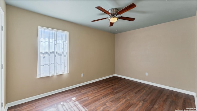 unfurnished room with ceiling fan and dark wood-type flooring