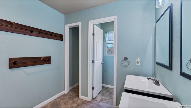 bathroom with vanity and tile patterned floors