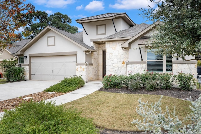 view of front of home with a garage and a front yard