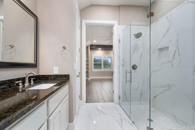 bathroom with vanity, a shower with shower door, and wood-type flooring