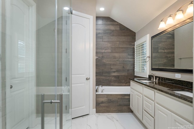 bathroom with plus walk in shower, vanity, vaulted ceiling, and wood walls