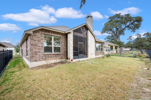 back of property with a yard