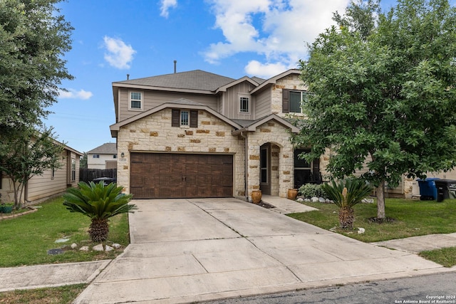 view of front of property with a garage and a front lawn