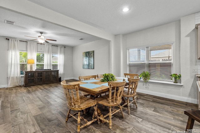 dining space featuring ceiling fan, a textured ceiling, and hardwood / wood-style flooring