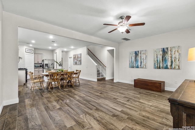 dining area featuring dark hardwood / wood-style flooring and ceiling fan