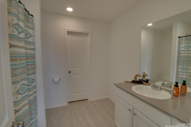 bathroom featuring vanity and hardwood / wood-style flooring