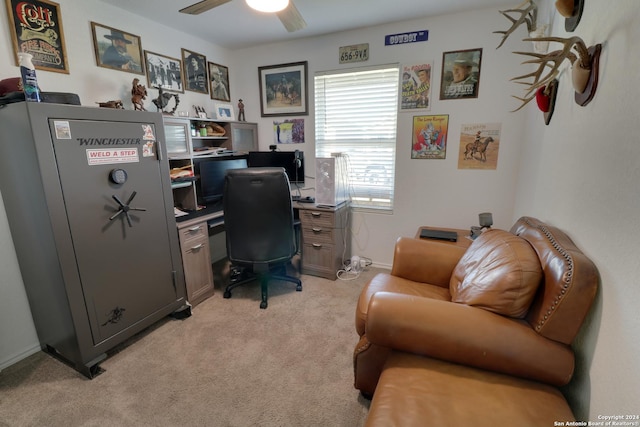 carpeted office space with ceiling fan