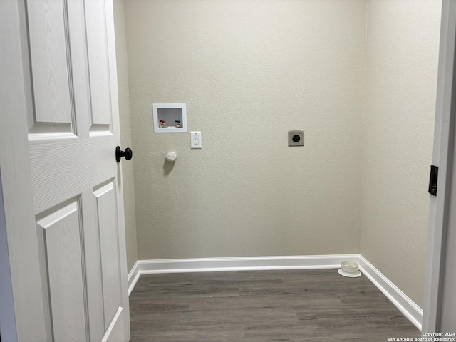 laundry room featuring hookup for an electric dryer, dark hardwood / wood-style floors, and hookup for a washing machine