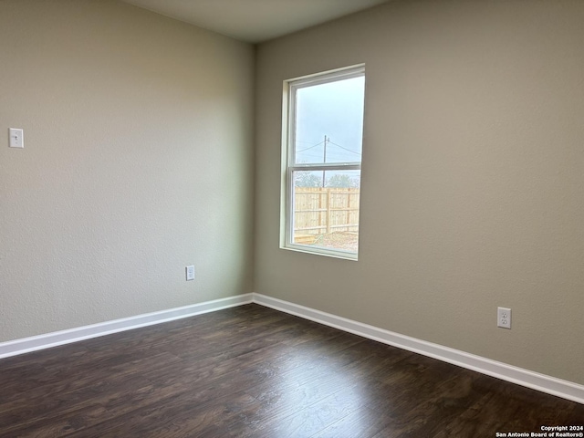 empty room featuring dark hardwood / wood-style floors