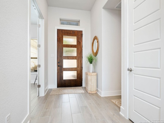 foyer with light wood-type flooring