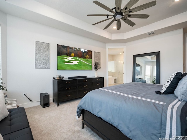 carpeted bedroom featuring ensuite bathroom and ceiling fan