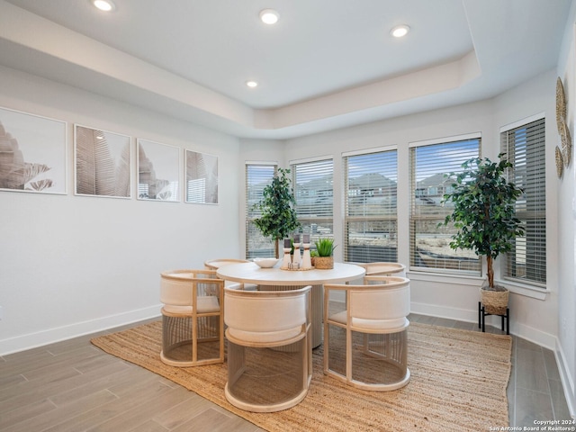 dining space with hardwood / wood-style flooring