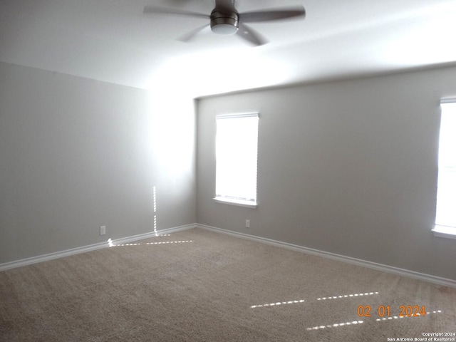 unfurnished room featuring carpet and ceiling fan