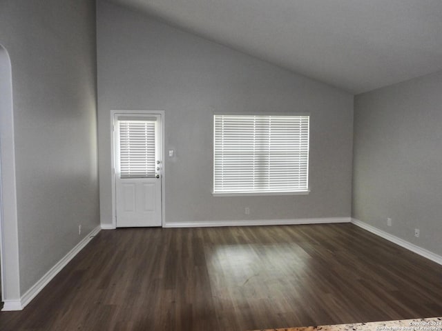 entryway featuring dark hardwood / wood-style floors and high vaulted ceiling