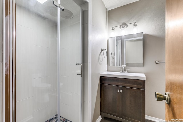 bathroom featuring vanity and a shower with door