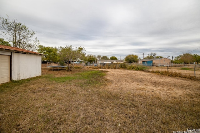 view of yard with a trampoline