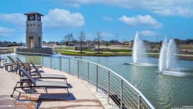 view of home's community with a water view