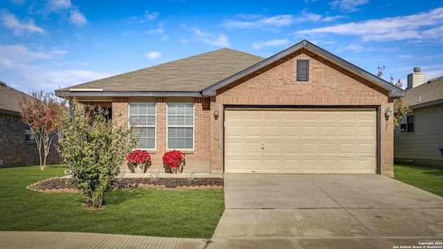 view of front of property with a garage and a front yard