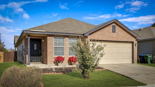 single story home featuring a garage and a front lawn