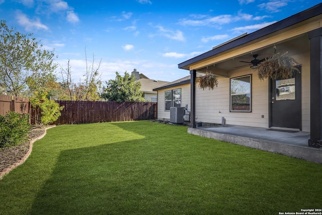 view of yard with a patio, ceiling fan, and central air condition unit