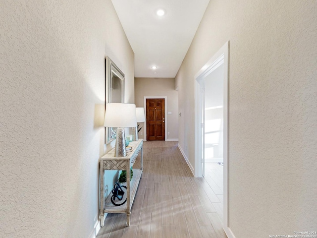 hallway featuring light wood-type flooring