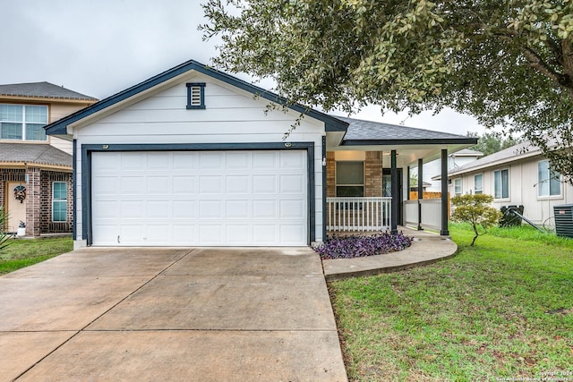 ranch-style home featuring covered porch, a garage, and a front lawn