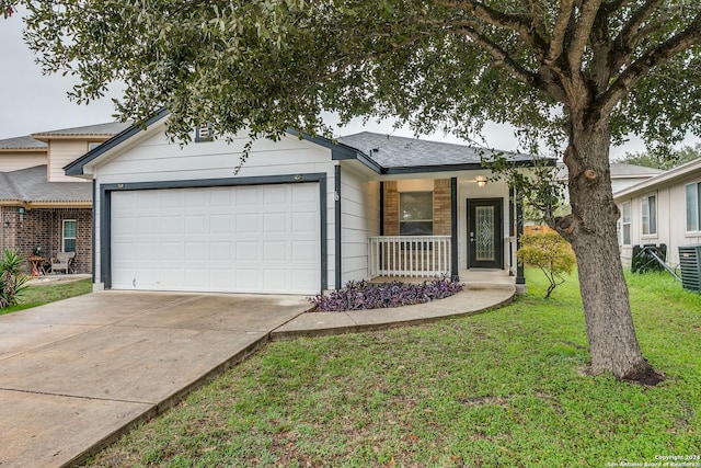 single story home featuring a front lawn, covered porch, and a garage