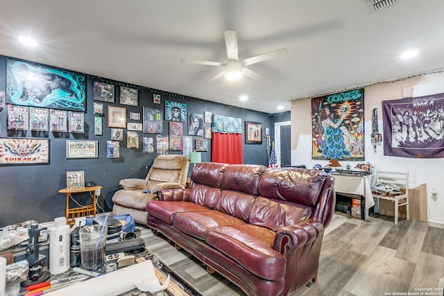 living room featuring hardwood / wood-style flooring and ceiling fan