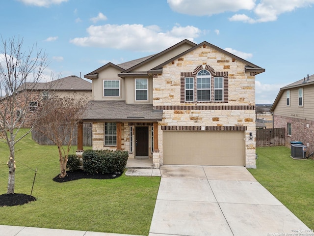 view of front of house with a garage, central AC unit, and a front lawn