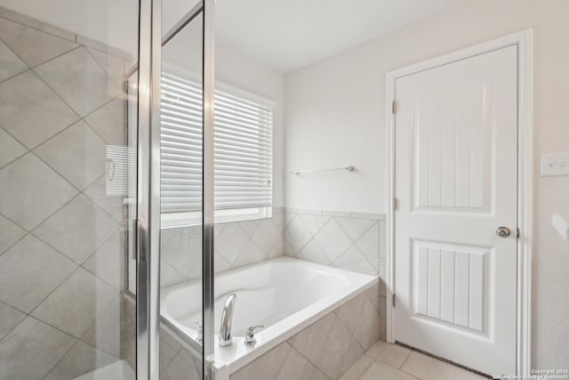 bathroom with tile patterned floors and separate shower and tub