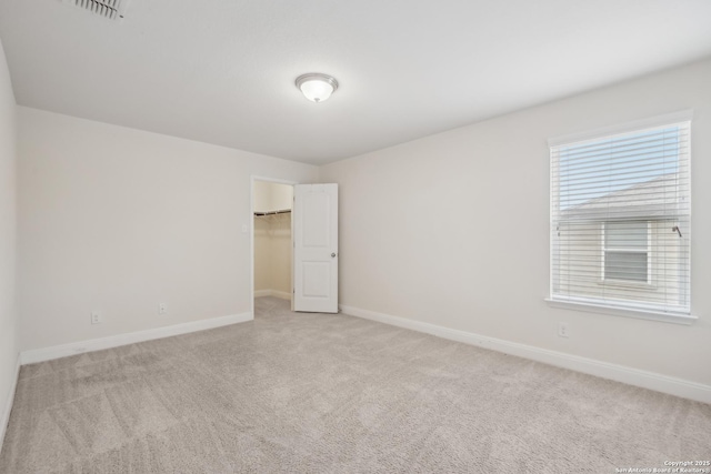 empty room with light colored carpet