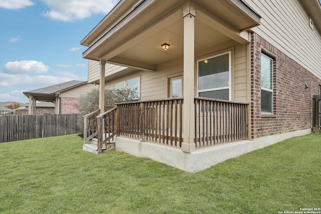 view of home's exterior with a lawn and a deck