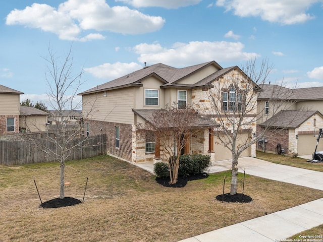 view of front of property with a garage and a front yard