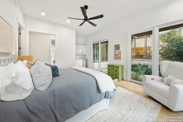 bedroom with access to exterior, light wood-type flooring, and ceiling fan