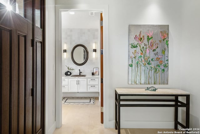 bathroom featuring tile patterned flooring and vanity