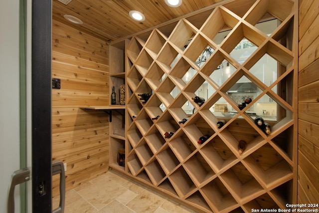 wine area featuring wooden walls and wood ceiling