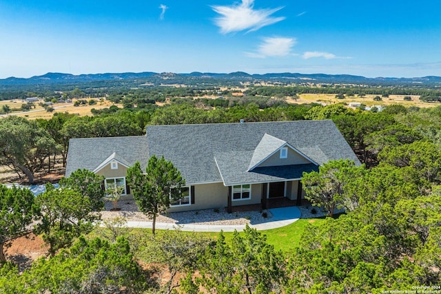 birds eye view of property with a mountain view