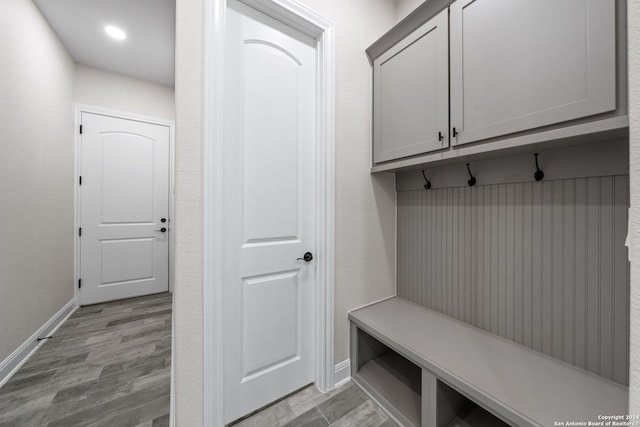 mudroom with light hardwood / wood-style floors