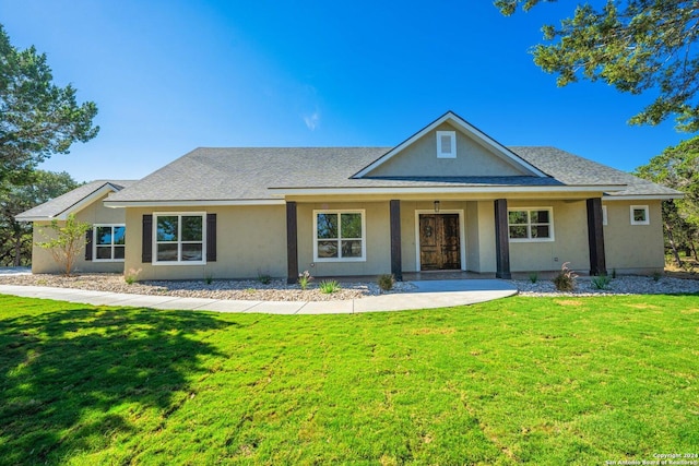 view of front of house featuring a porch and a front lawn