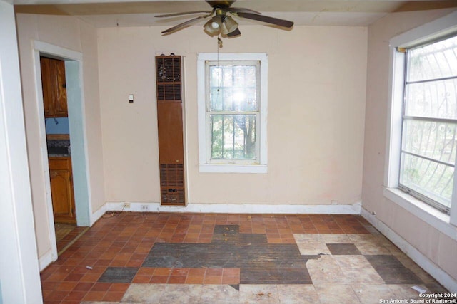 empty room with plenty of natural light and ceiling fan