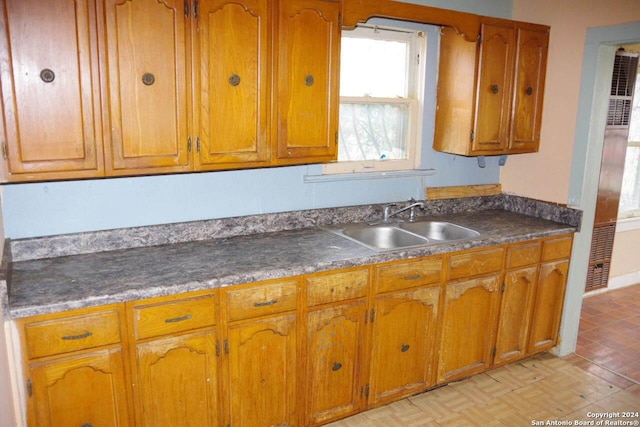 kitchen with light parquet flooring and sink