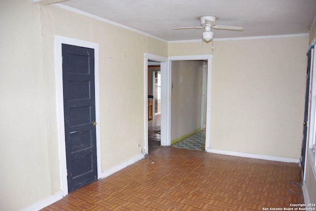 unfurnished room with ceiling fan, parquet flooring, and crown molding