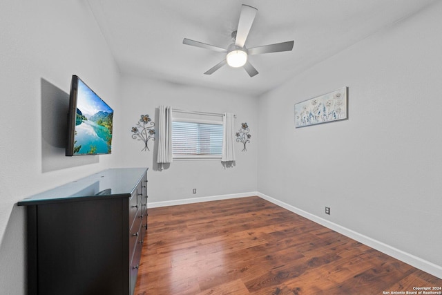 interior space with dark hardwood / wood-style floors and ceiling fan