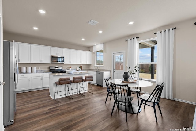 dining space with dark wood-type flooring