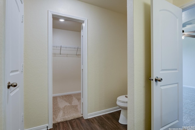 bathroom with toilet and hardwood / wood-style flooring